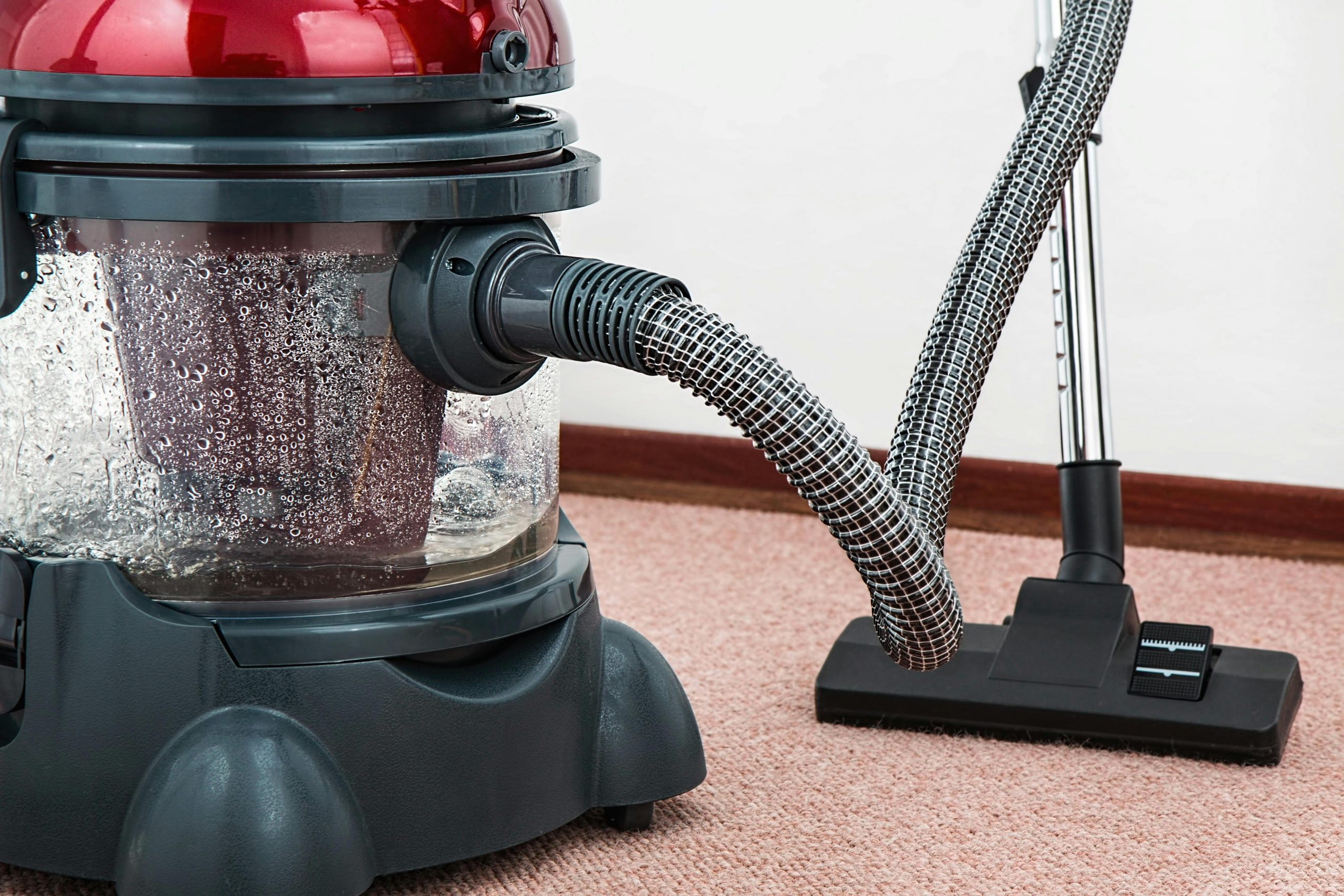 vacuum cleaner on carpeted flooring