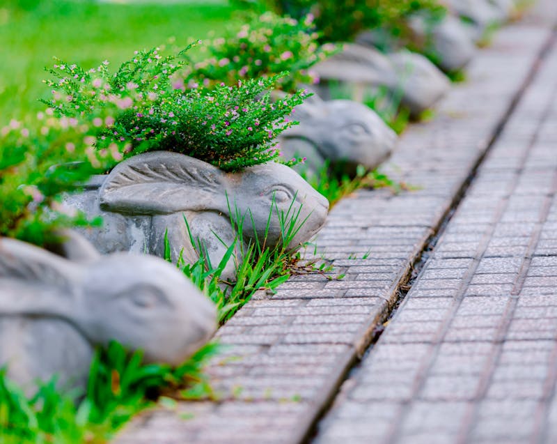 concrete rabbits as decorative landscaping elements